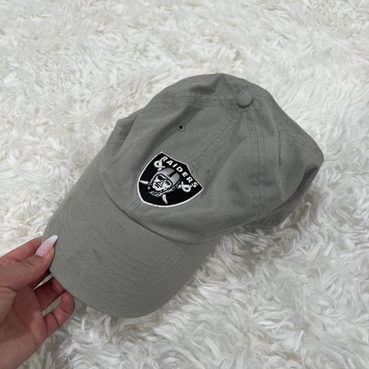 beige raiders hat