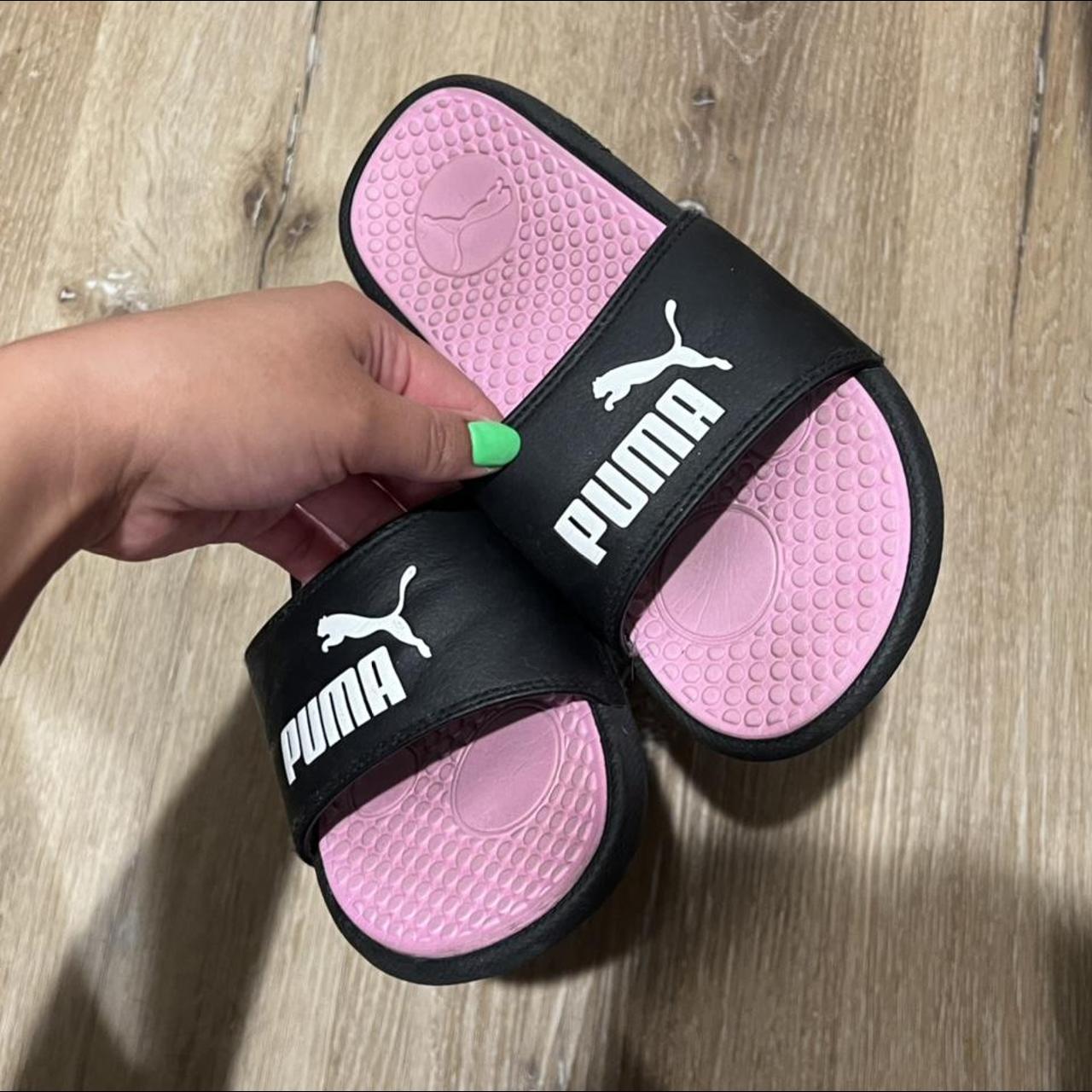 black and pink puma slides