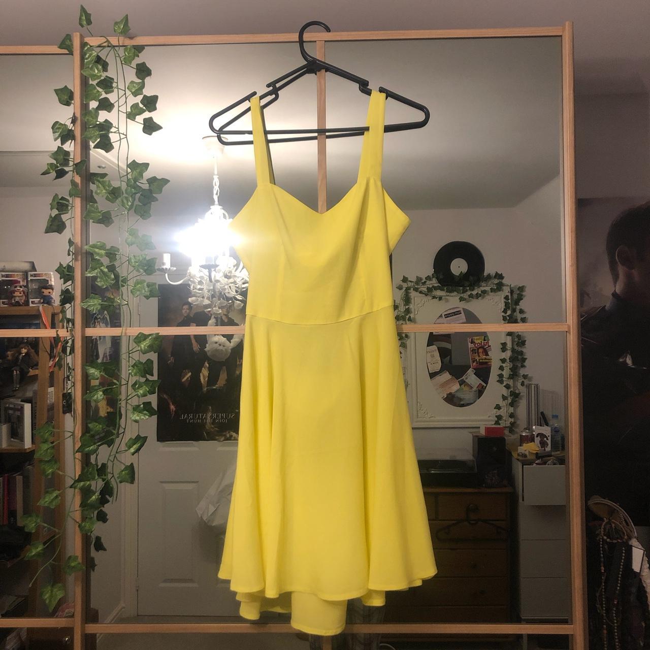 Bright yellow floaty backless summer dress with a... - Depop