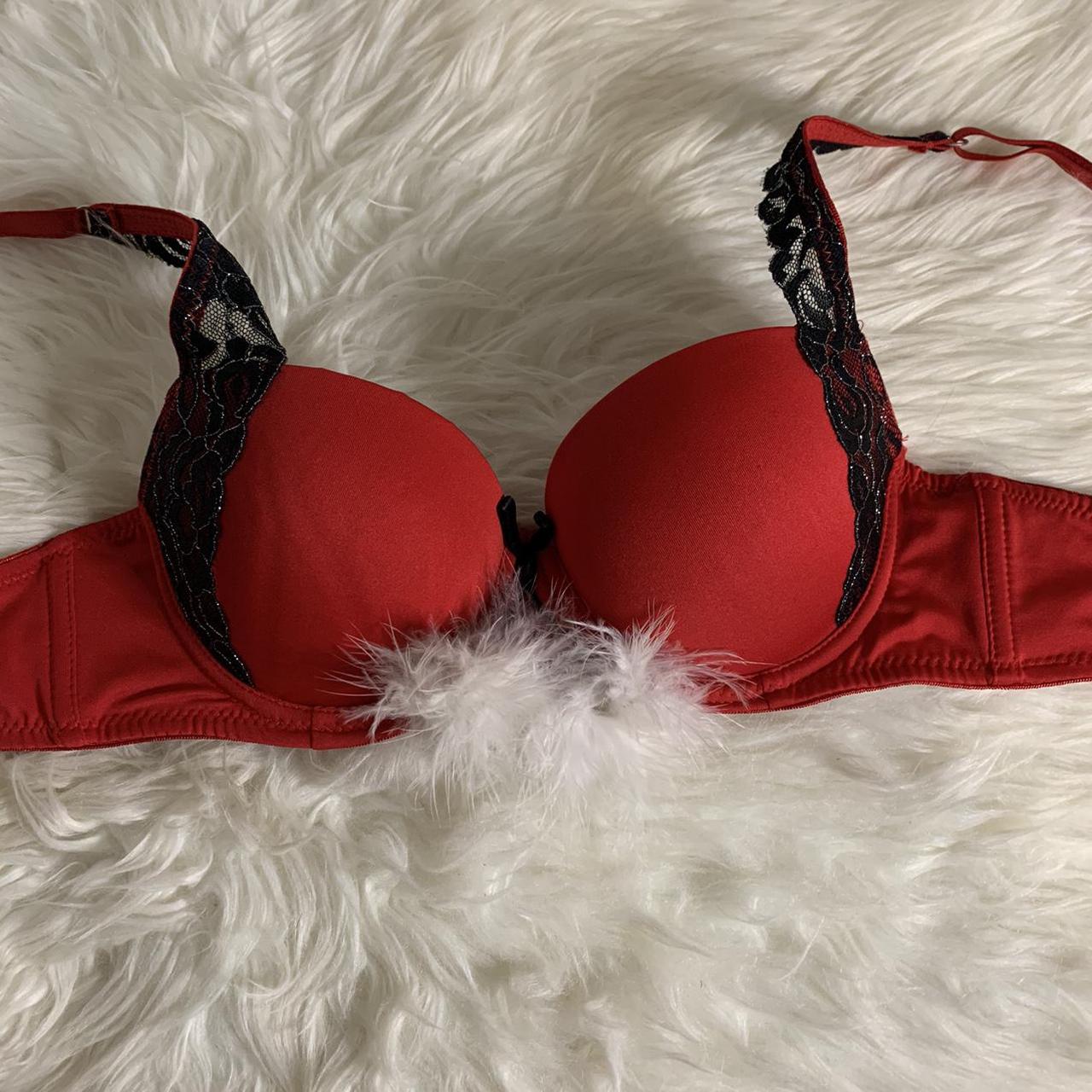 Red & black push up bra with white fuzzy balls This - Depop