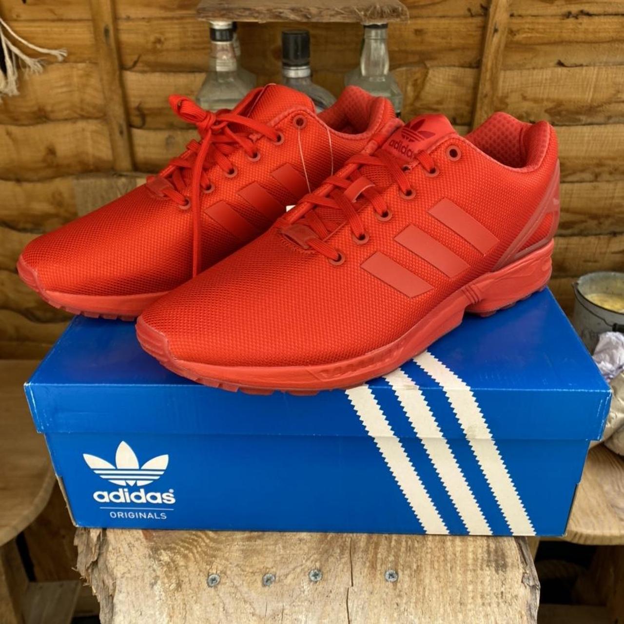 ZX running shoes. Rare mono red... - Depop