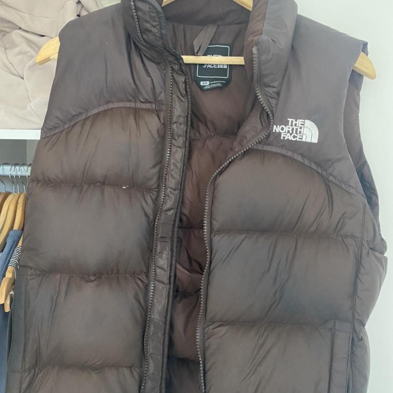 Chocolate brown the north face body warmer, size... - Depop