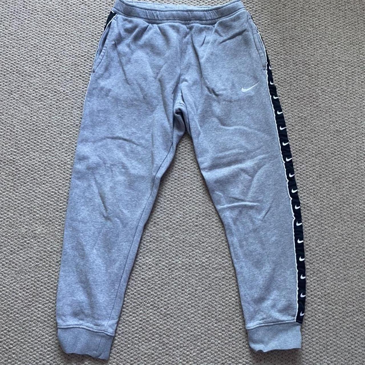 Nike taped poly track pants sale