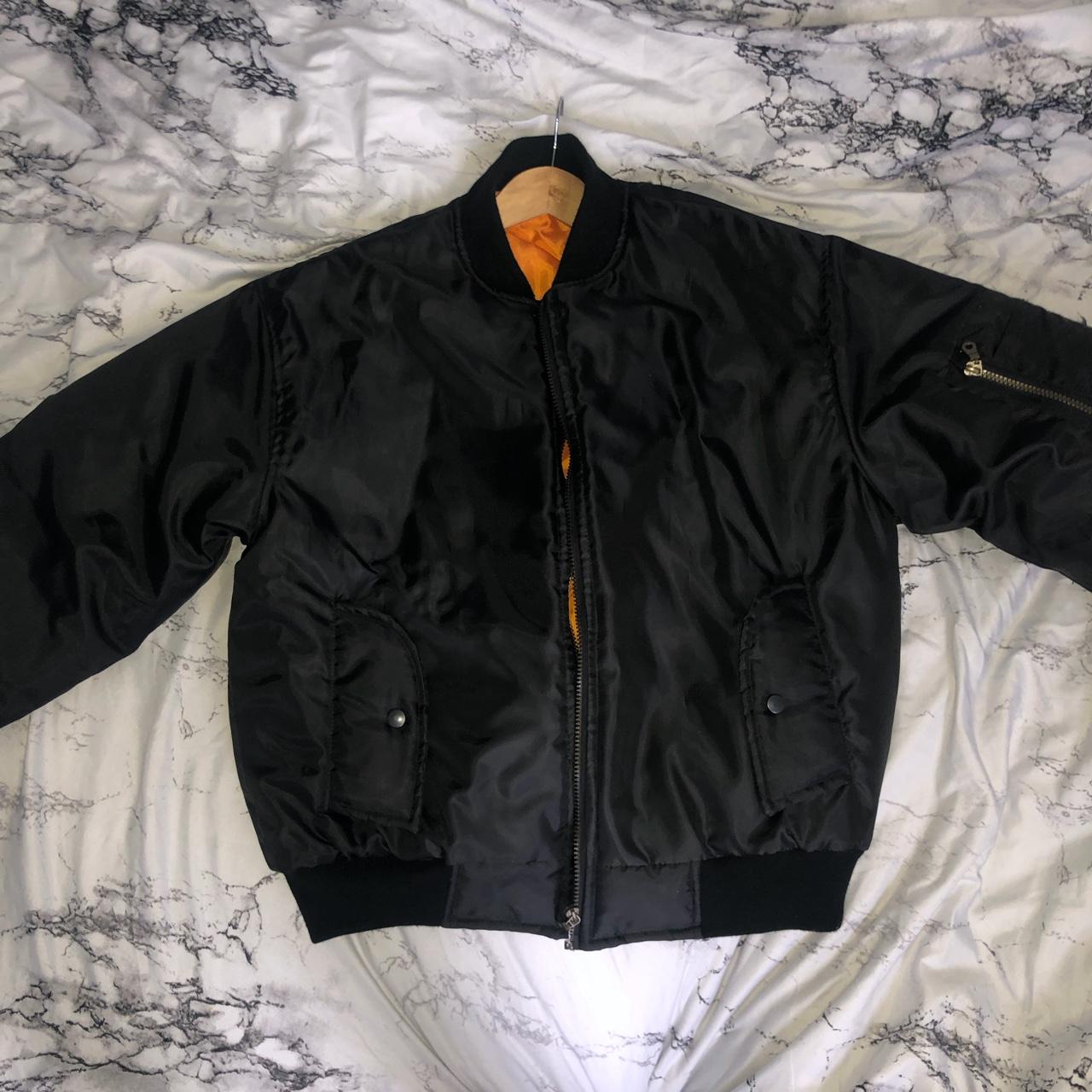 black and orange bomber jacket