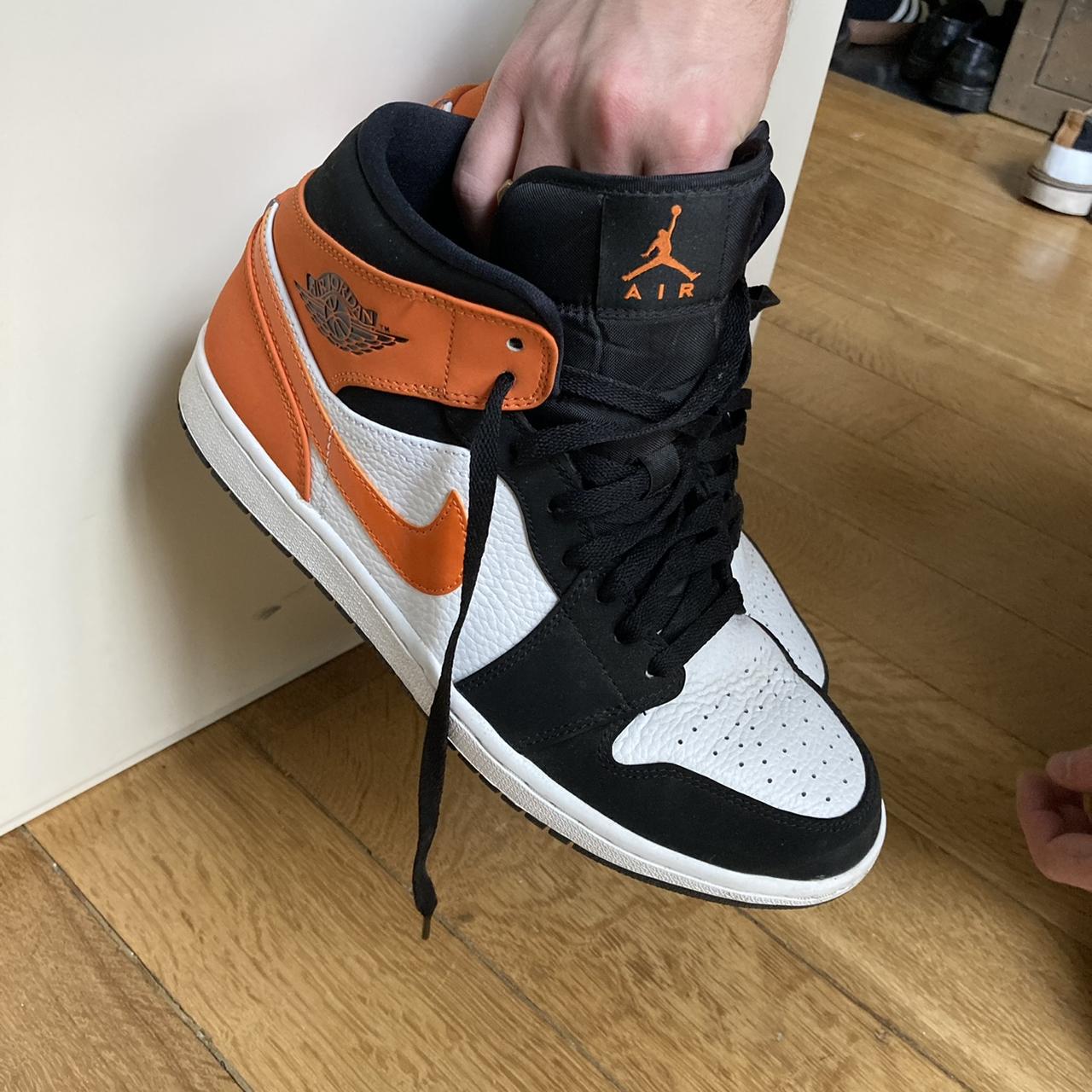 Black white and orange air jordans high tops near... Depop