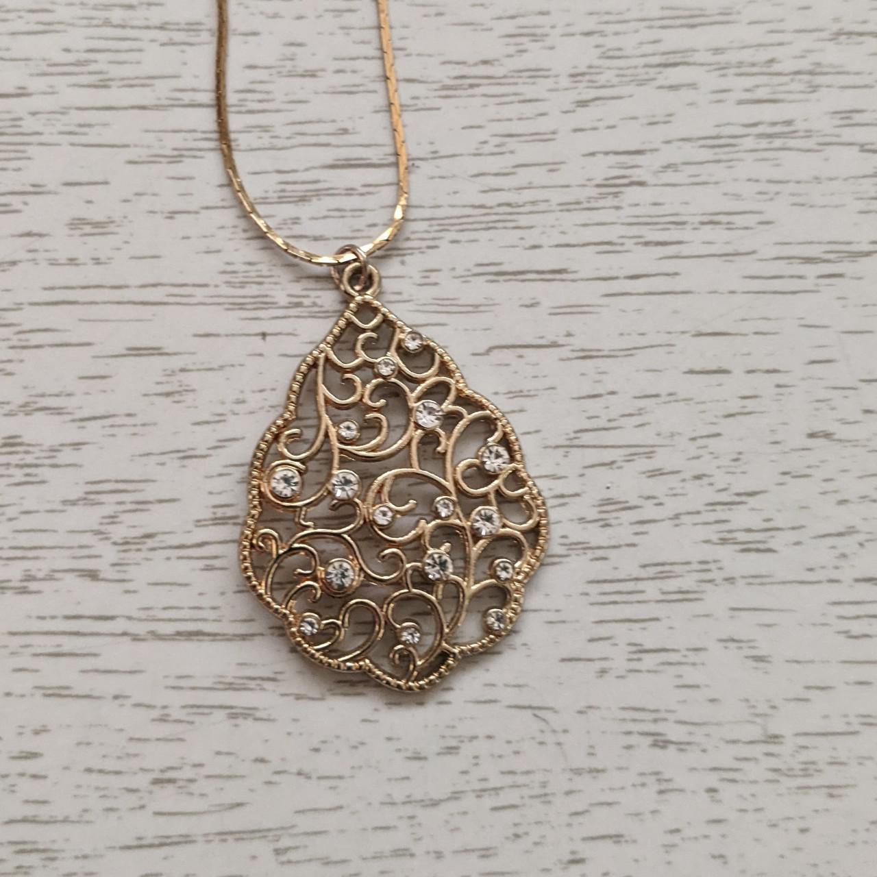 Pretty golden teardrop-shaped pendant necklace with... - Depop