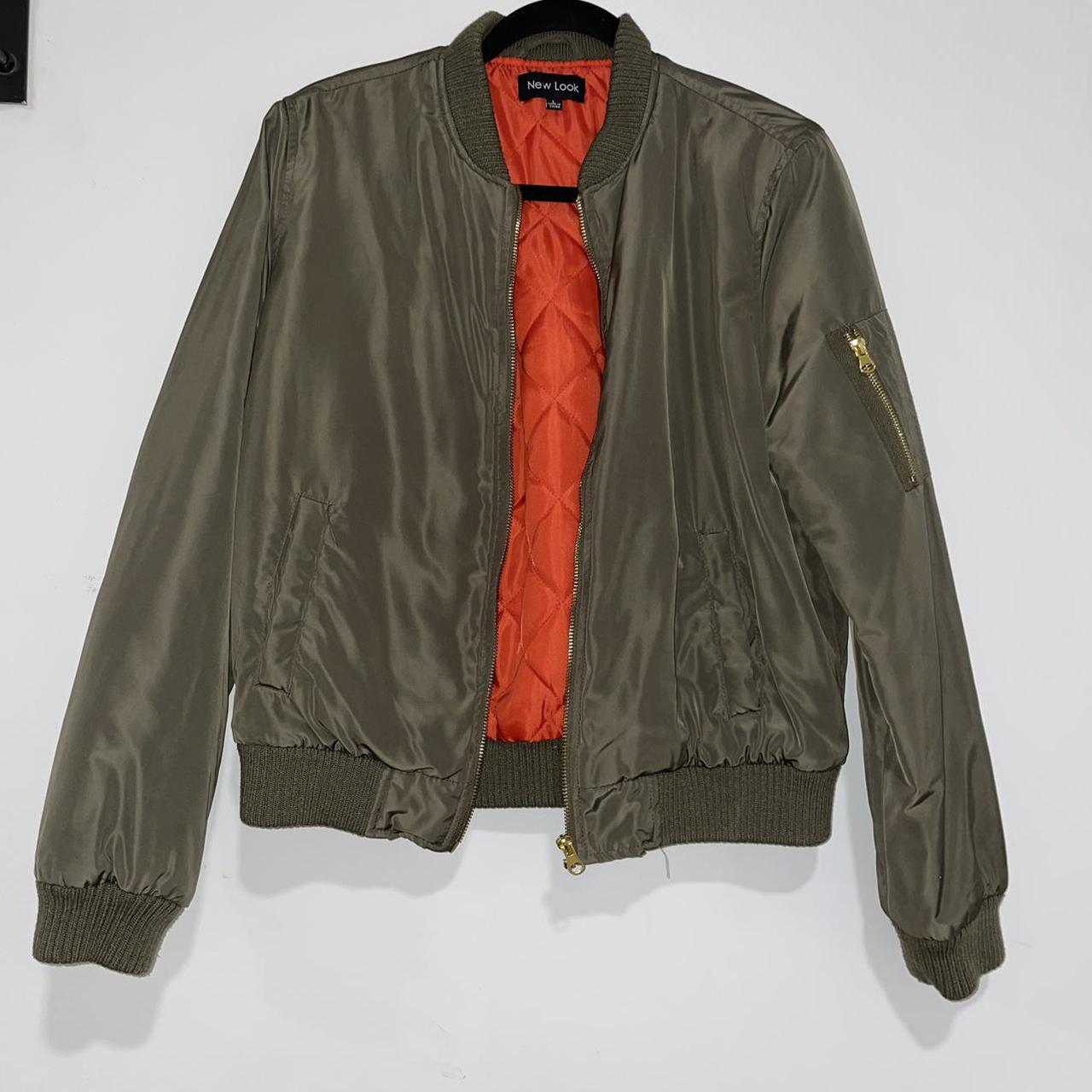 green bomber jacket with orange inside