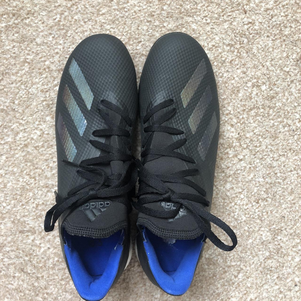 black Adidas astro boots with holographic stripes... - Depop