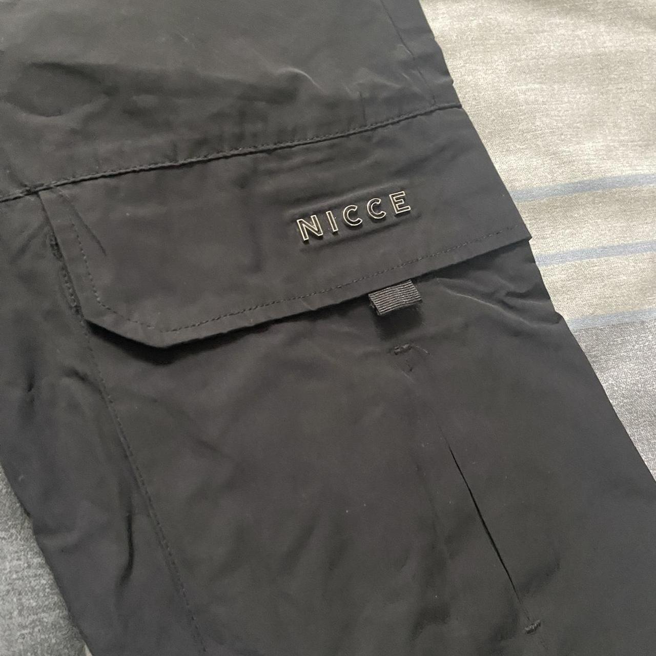 Black nicce cargo pants Size xs but will fit a... - Depop