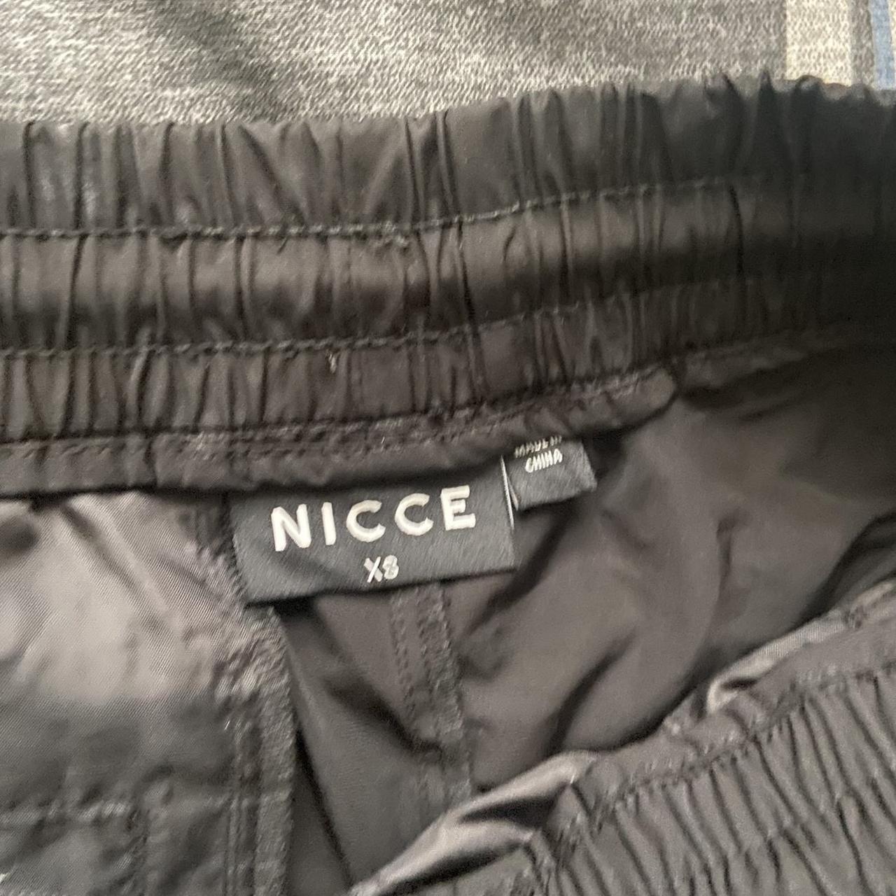 Black nicce cargo pants Size xs but will fit a... - Depop