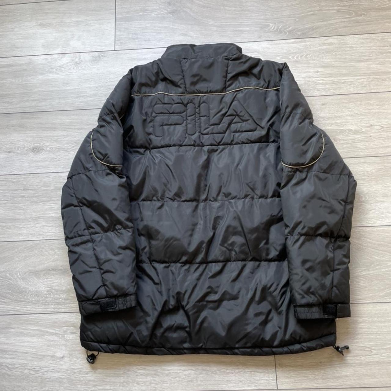 Early 2000s Black & Biege Fila Spellout Puffer... - Depop