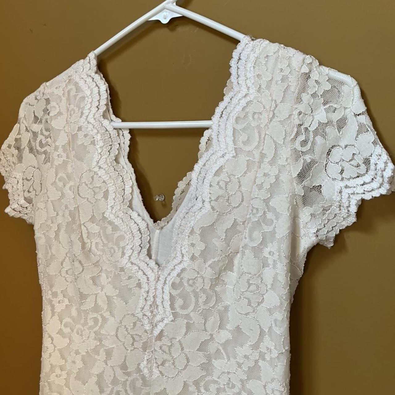 White lace minidress with a deep V - neck in the... - Depop