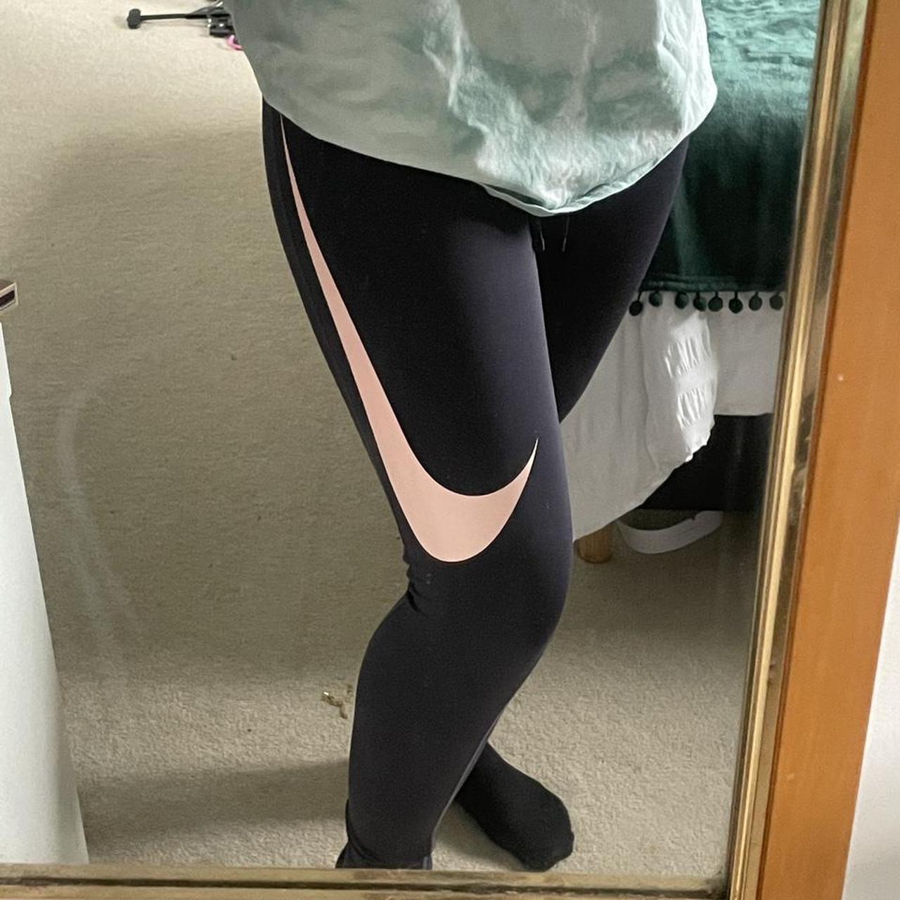 Navy blue Nike dri fit leggings with pink Nike tick