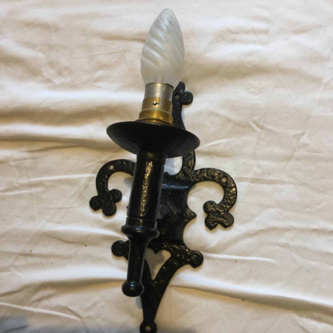Vintage cast iron wall light bracket. Attractive jet... Depop