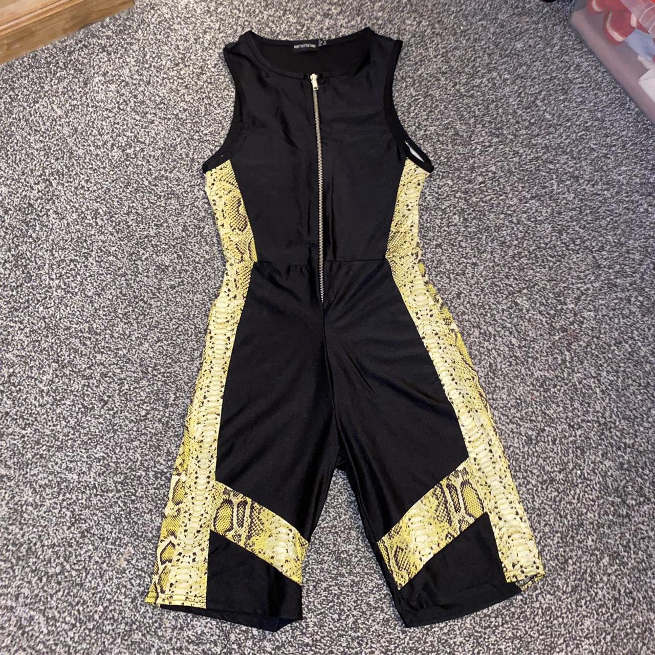 Black unitard with snake print panels great... Depop