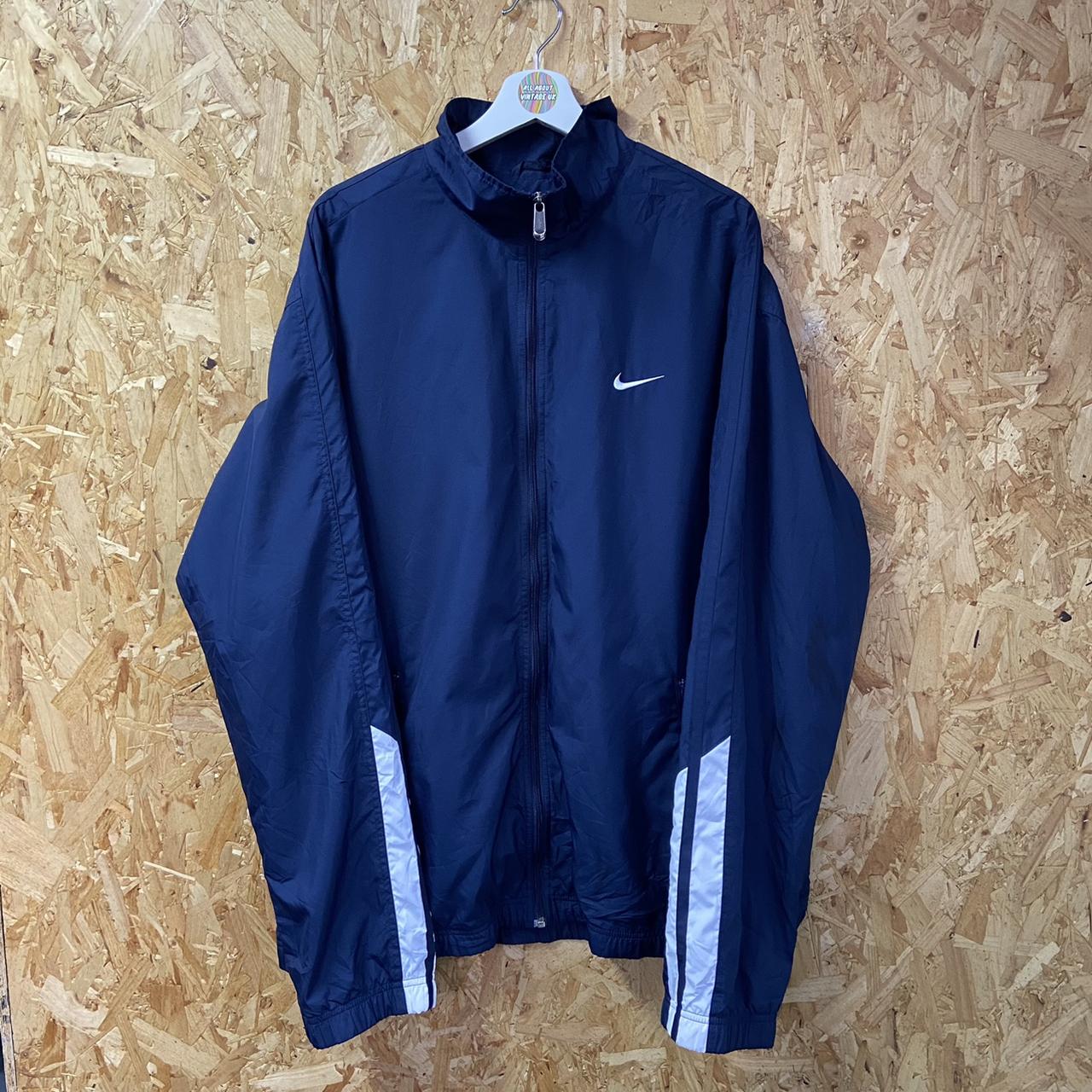 Nike Windbreaker. Nike navy windbreaker with stripe... - Depop