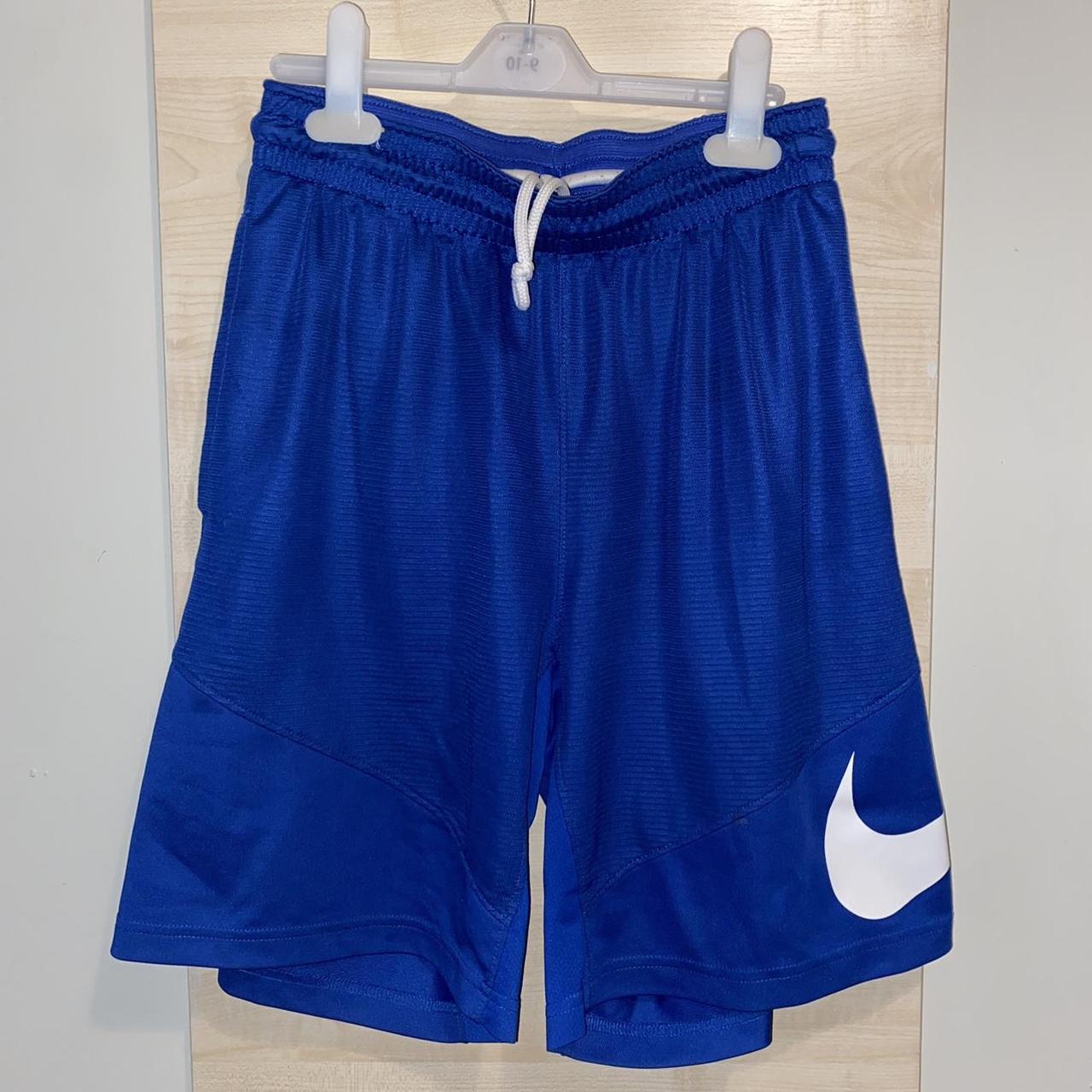 Nike blue basketball shorts with big swoosh on the... - Depop