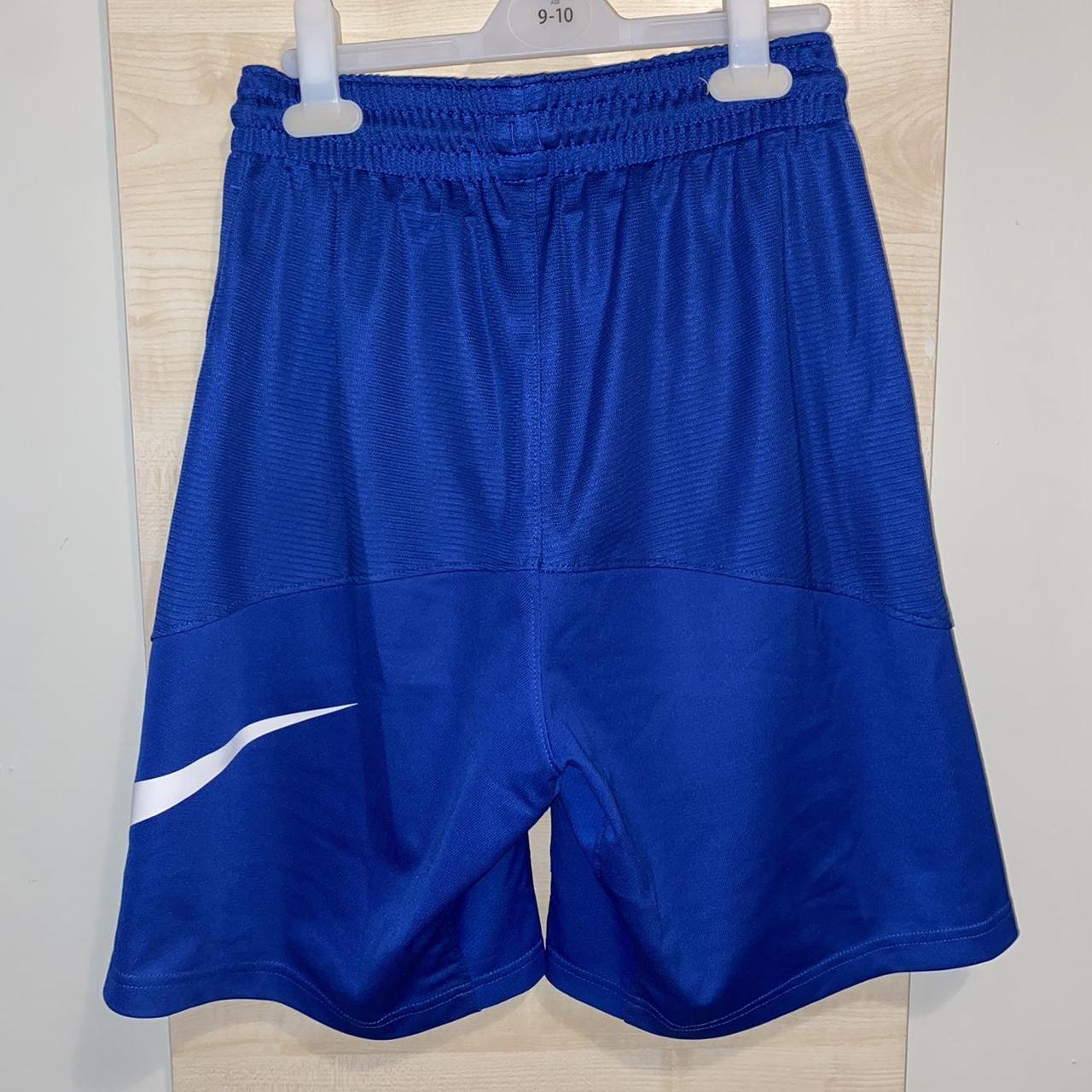 Nike blue basketball shorts with big swoosh on the... - Depop