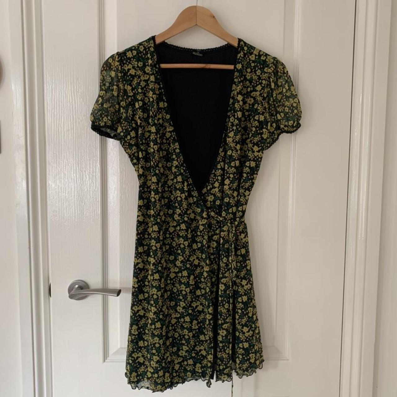 green and yellow floral mini wrap dress... Depop