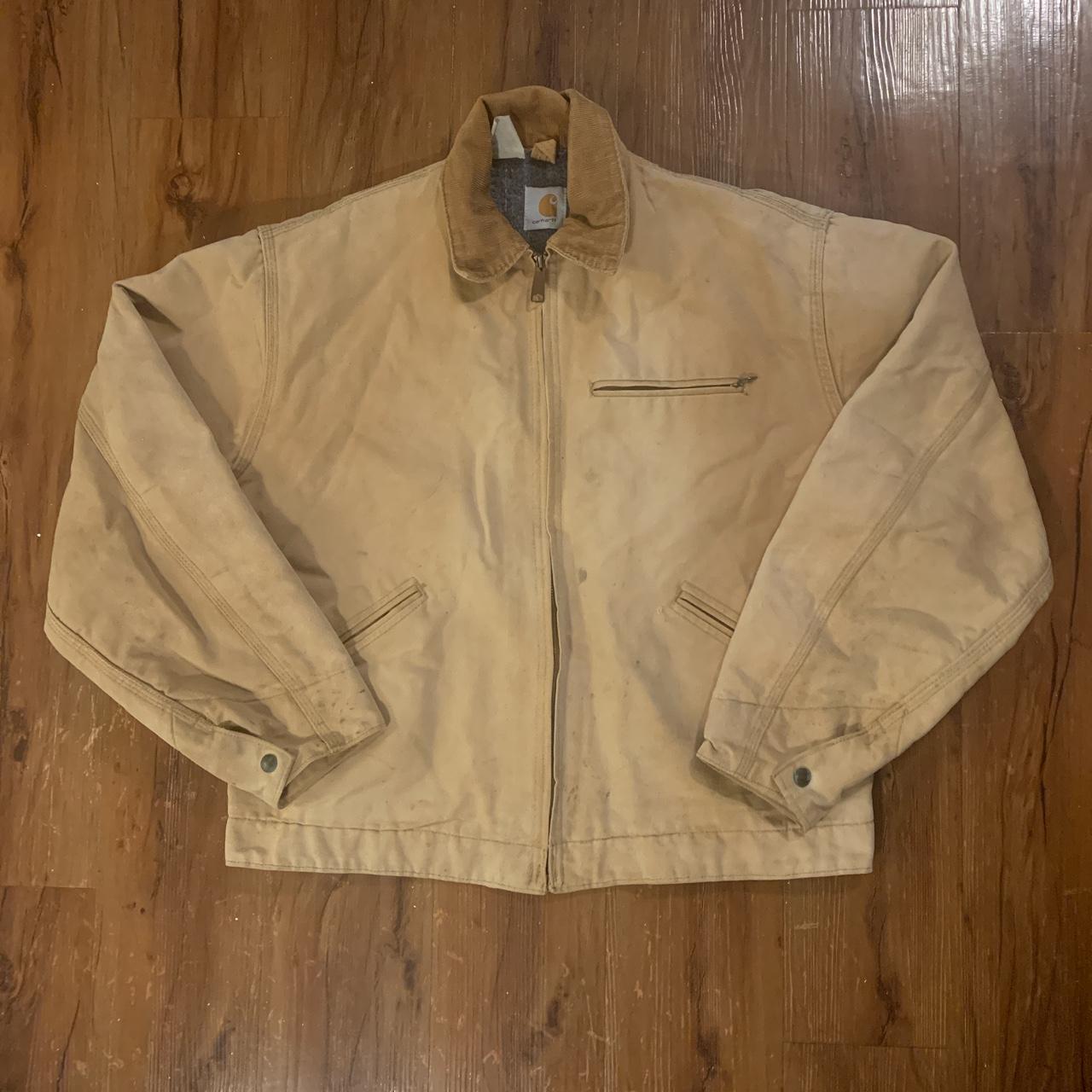 carhartt jacket no holes some marks and stains... - Depop
