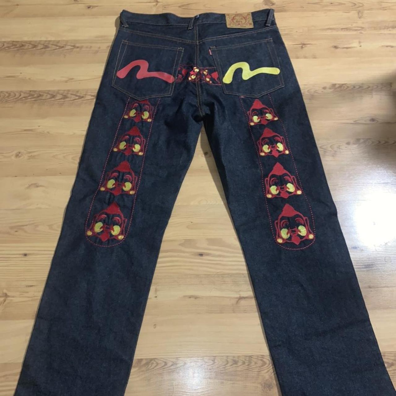 Rare Evisu print Jeans. Red and yellow stitching is