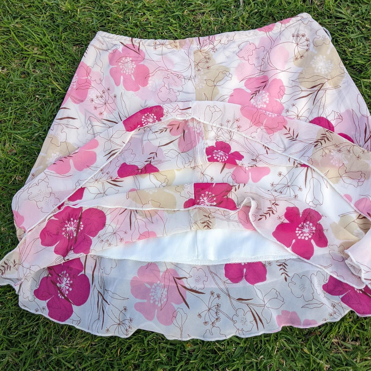 Flower print mini skirt would fit s/m no tag size... - Depop
