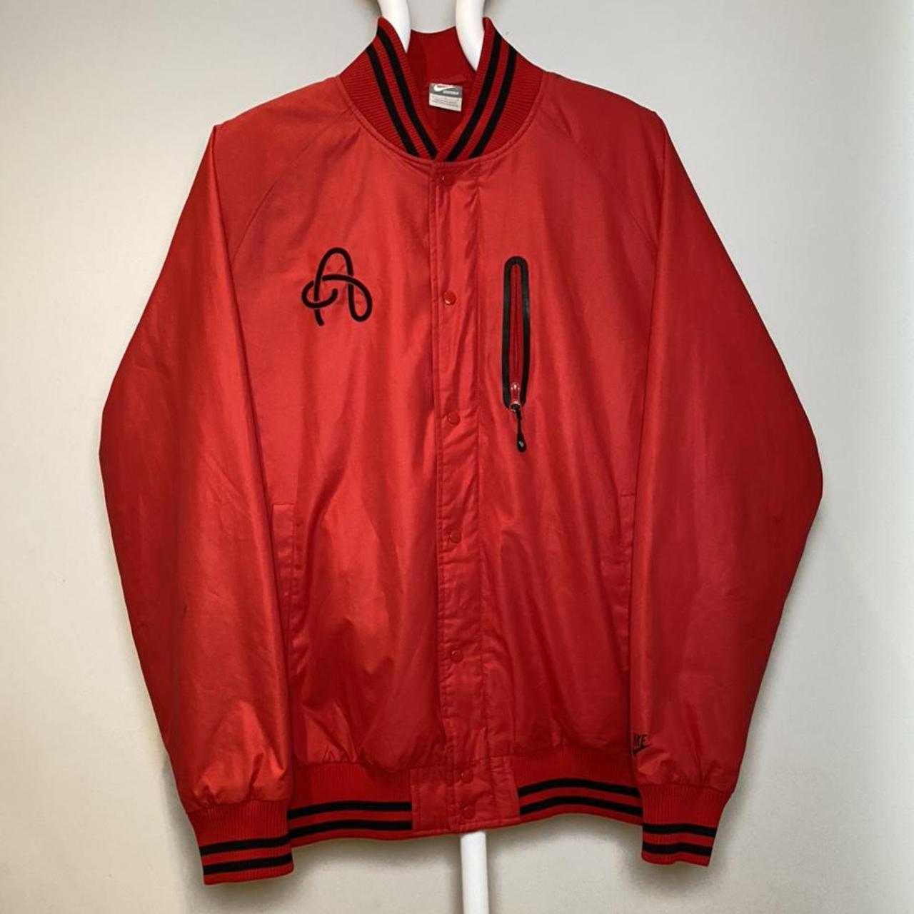 red and black nike coat