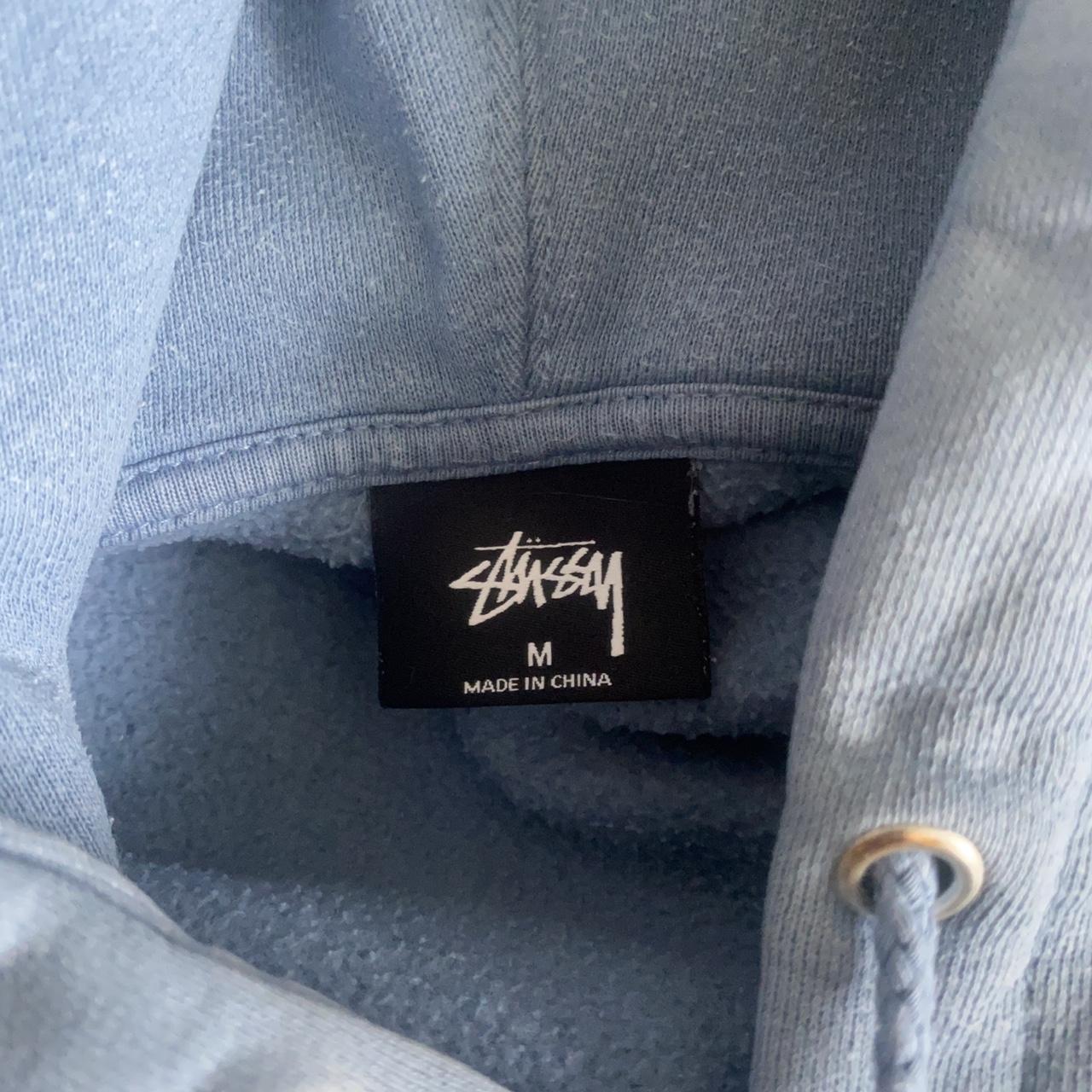 Stussy light blue hoodie w/ gold embroidered... - Depop
