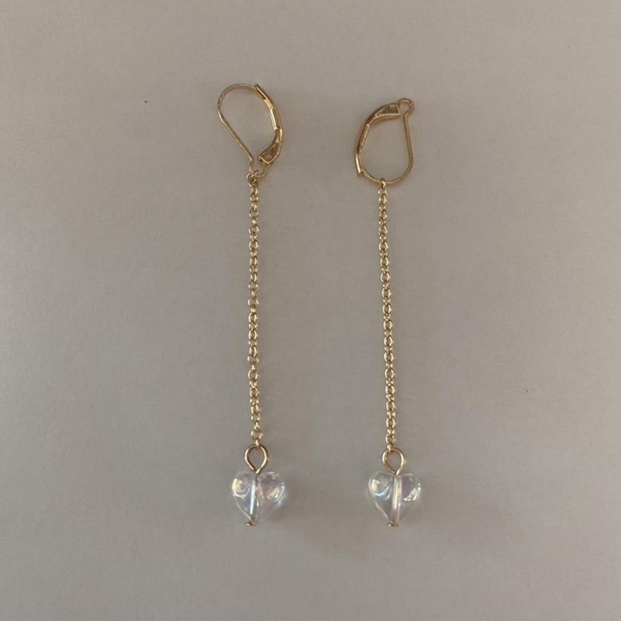 Brandy Melville gold dangling earrings with a clear... Depop