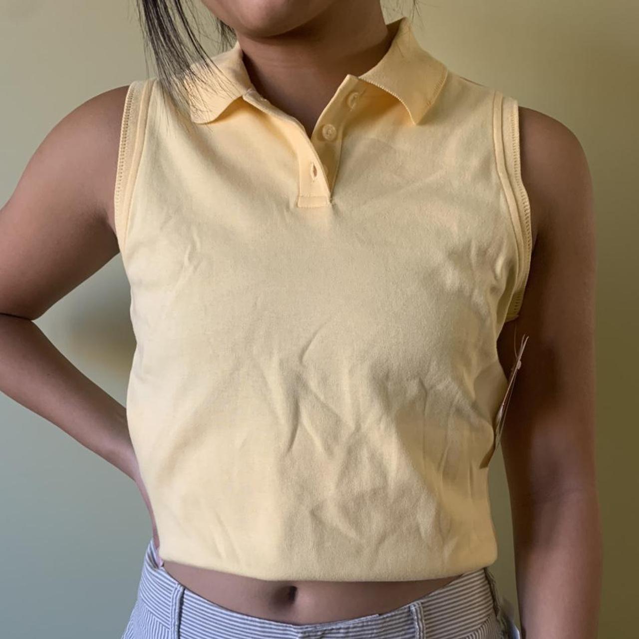 Cute yellow sleeveless polo shirt. Tag size medium,... Depop
