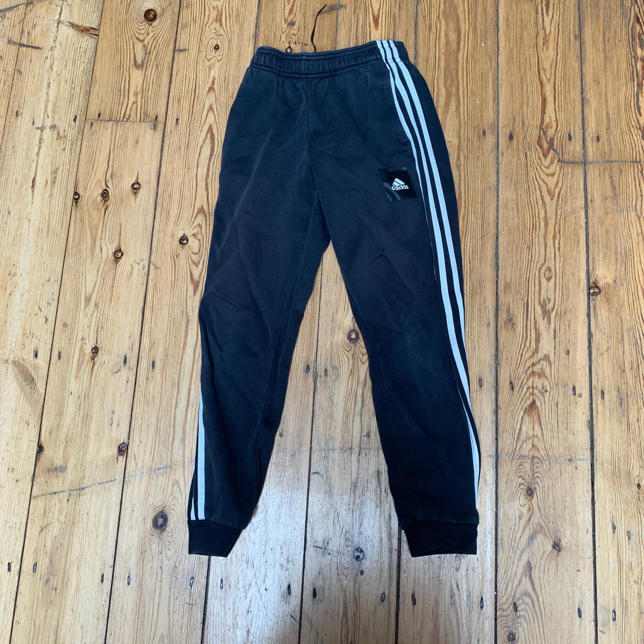 Black adidas striped tracksuit bottoms Pen on the... - Depop