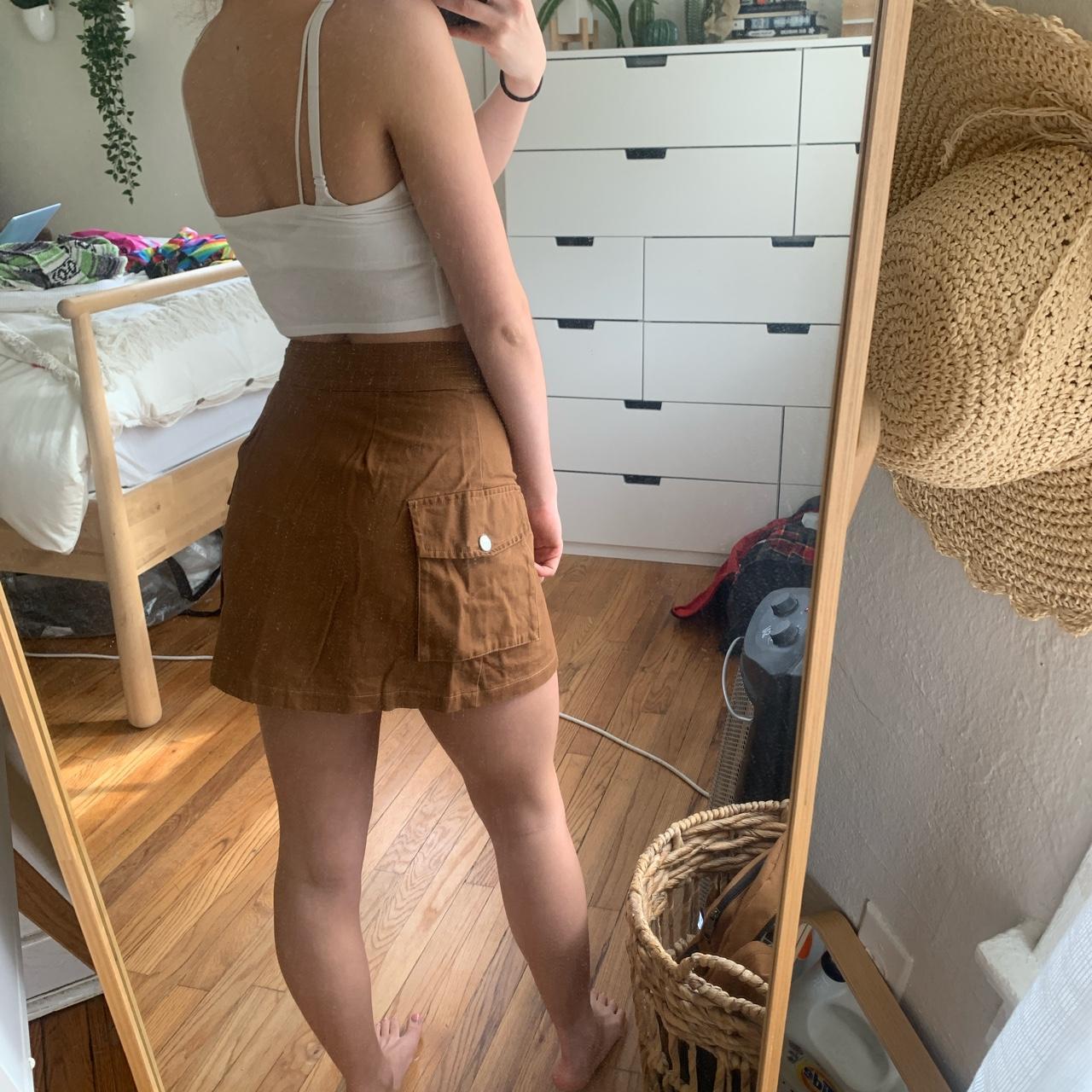 brown mini skirt with cargo pockets on the... Depop