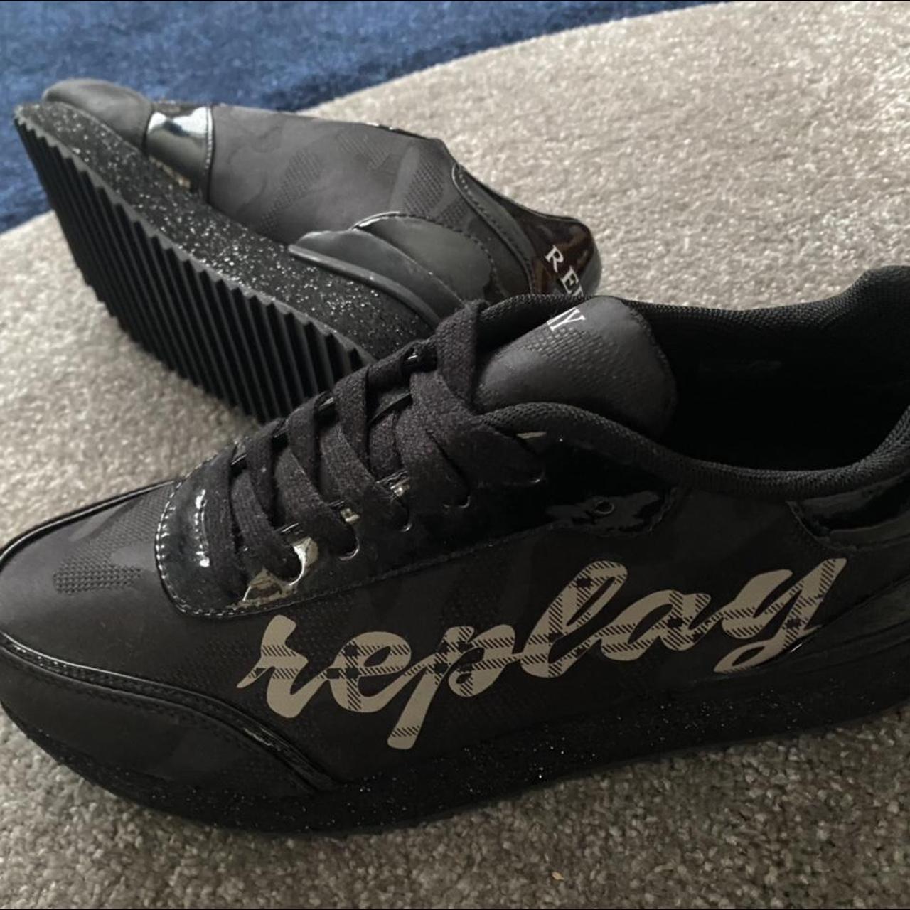 white & black reposto trainers