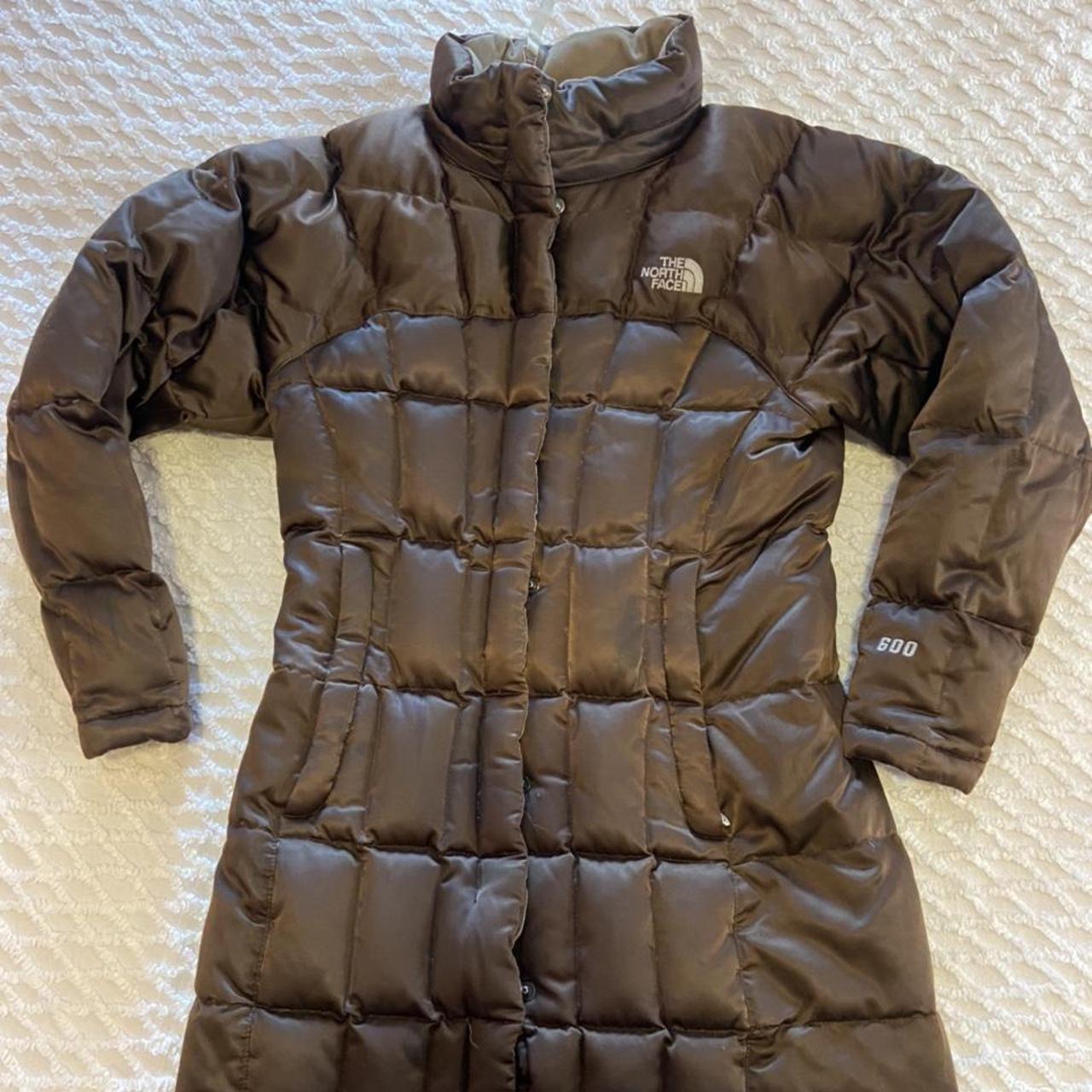 brown north face puffer. 600 fill. girls medium fits... - Depop