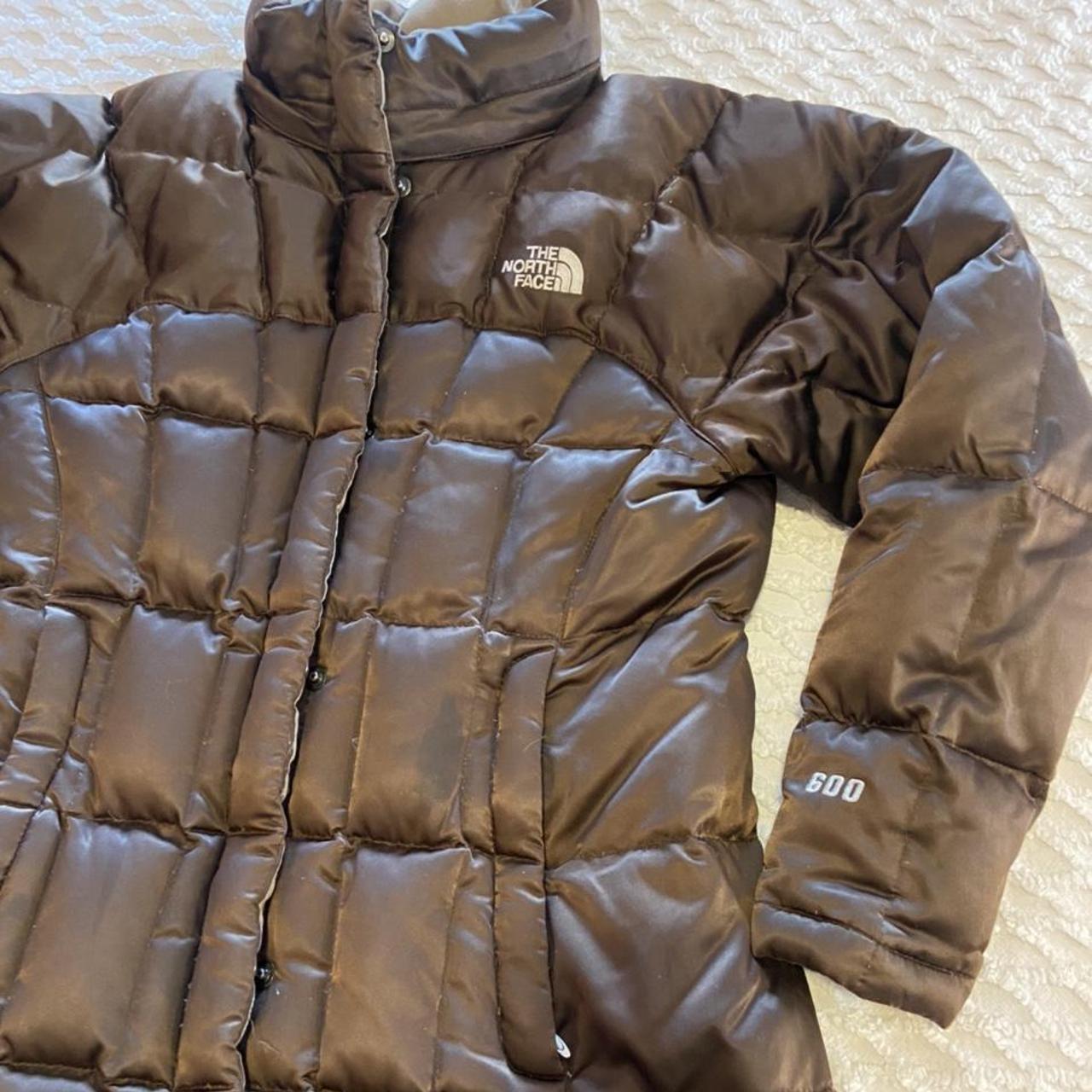 brown north face puffer. 600 fill. girls medium fits... - Depop