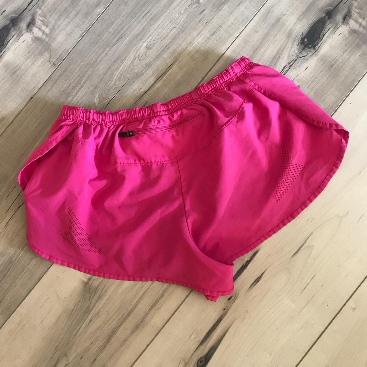 Sugoi split running shorts pink size... Depop
