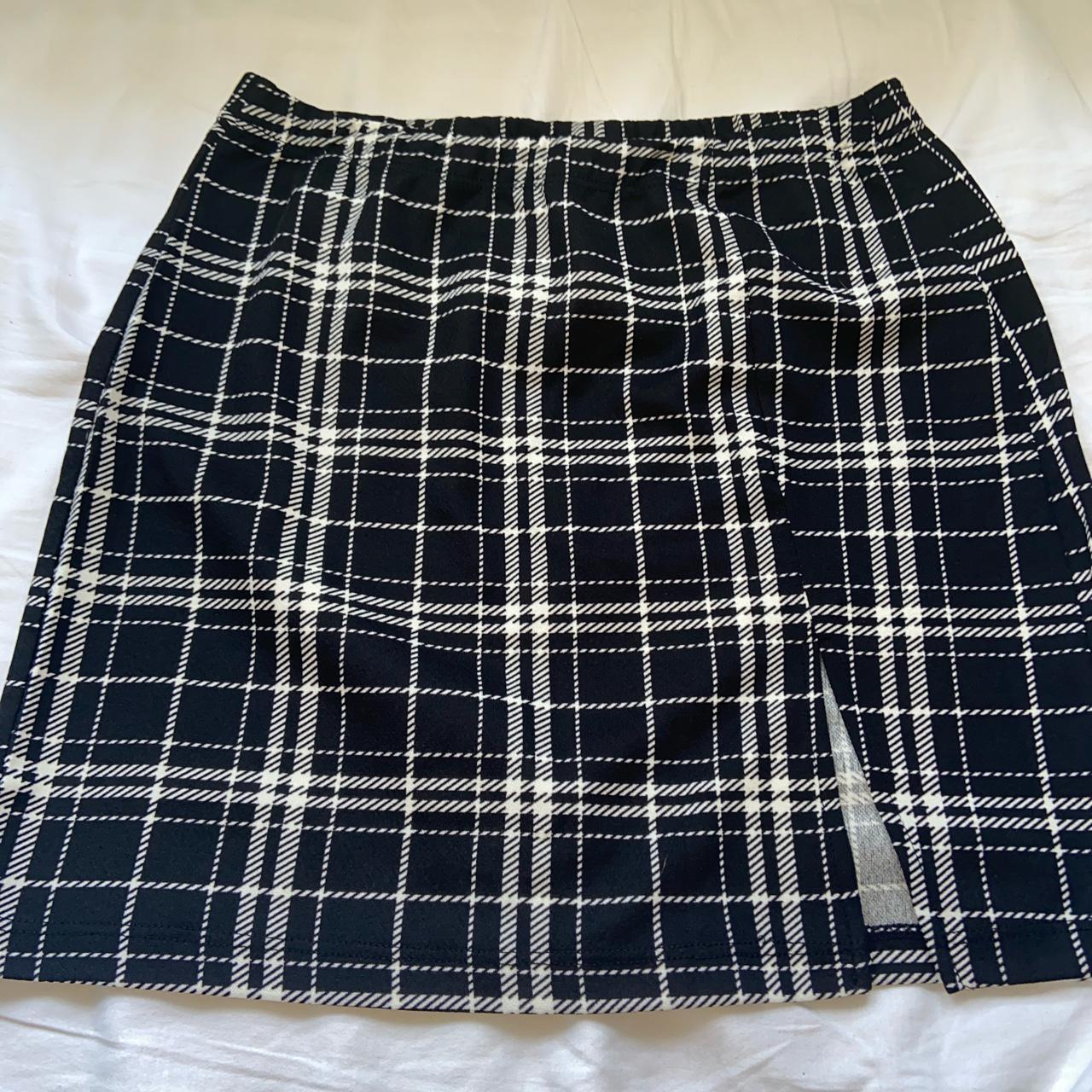 Black checkered skirt with front slit Small New... - Depop