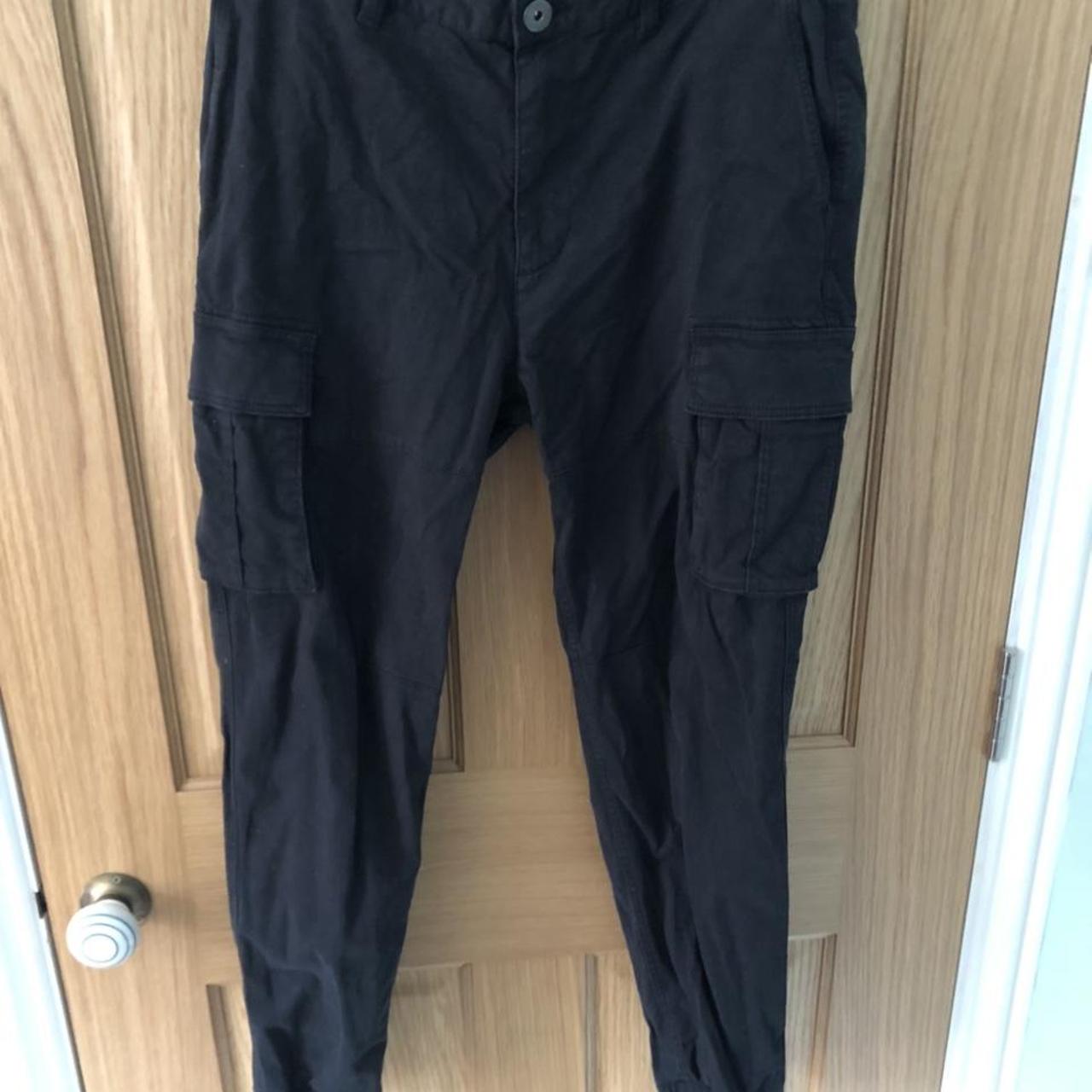 H&M black washed cargo trousers. Cuffed with elastic... - Depop