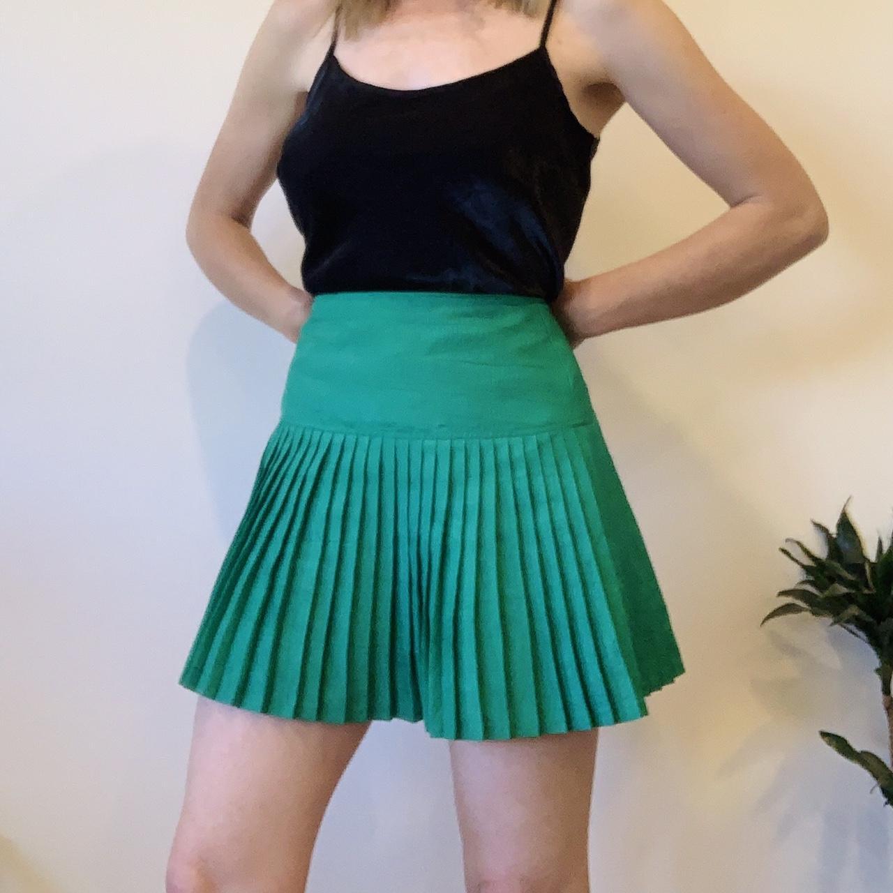 Green pleated netball skirt best sale