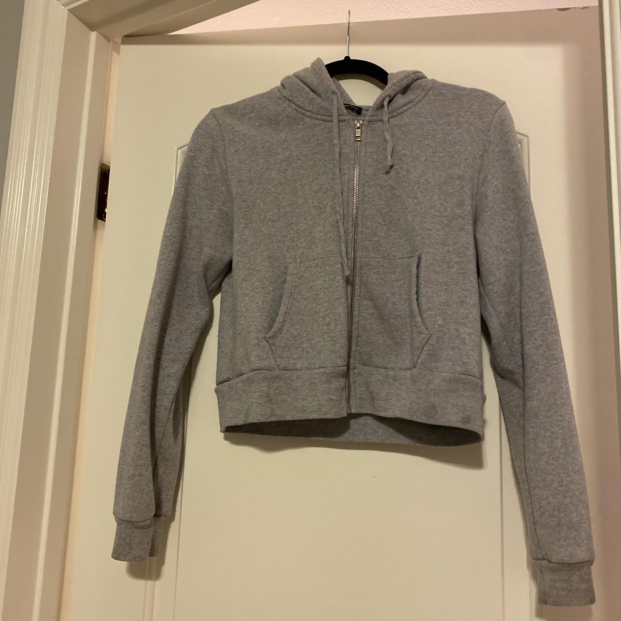 grey brandy melville zip up hoodie never worn,... Depop