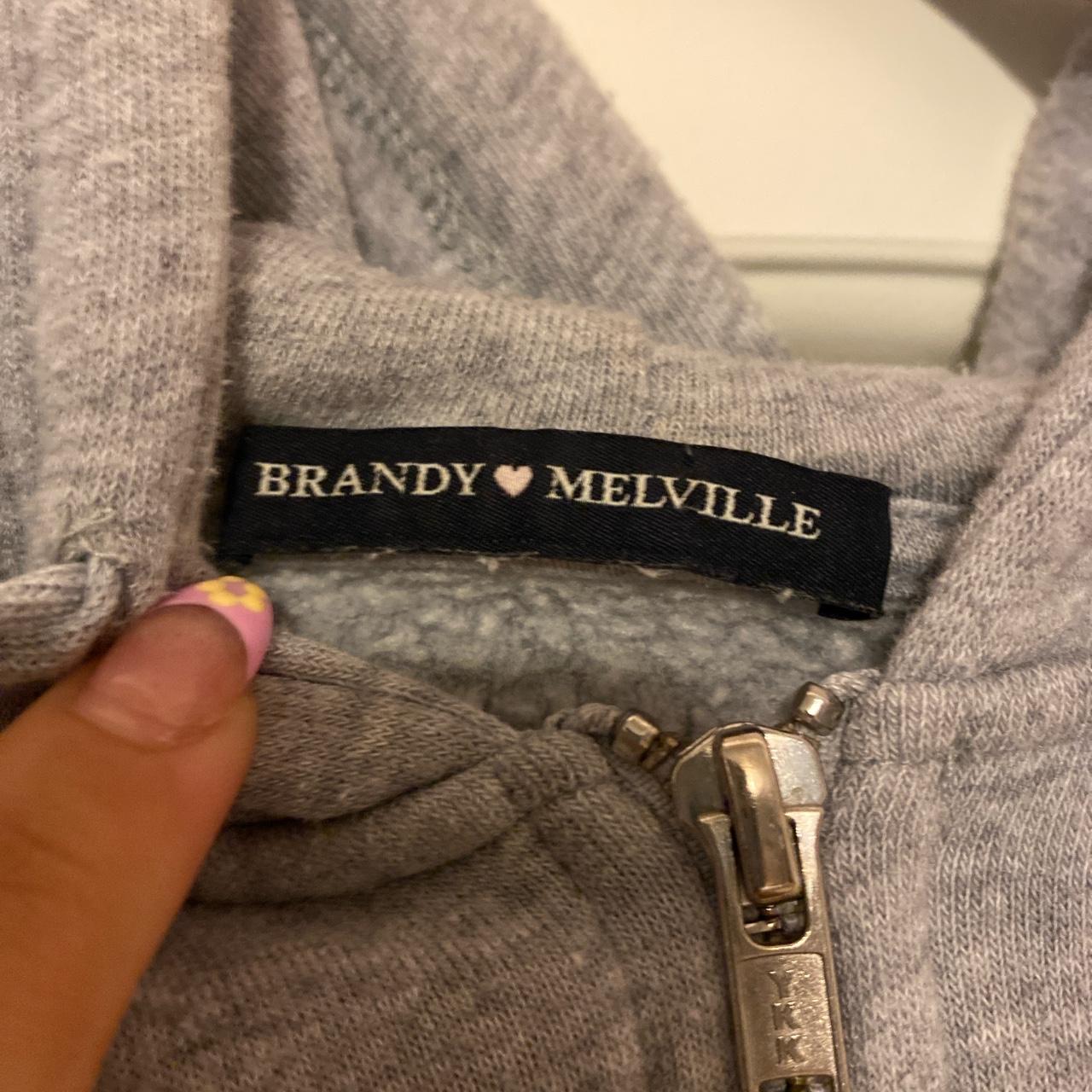 grey brandy melville zip up hoodie never worn,... Depop