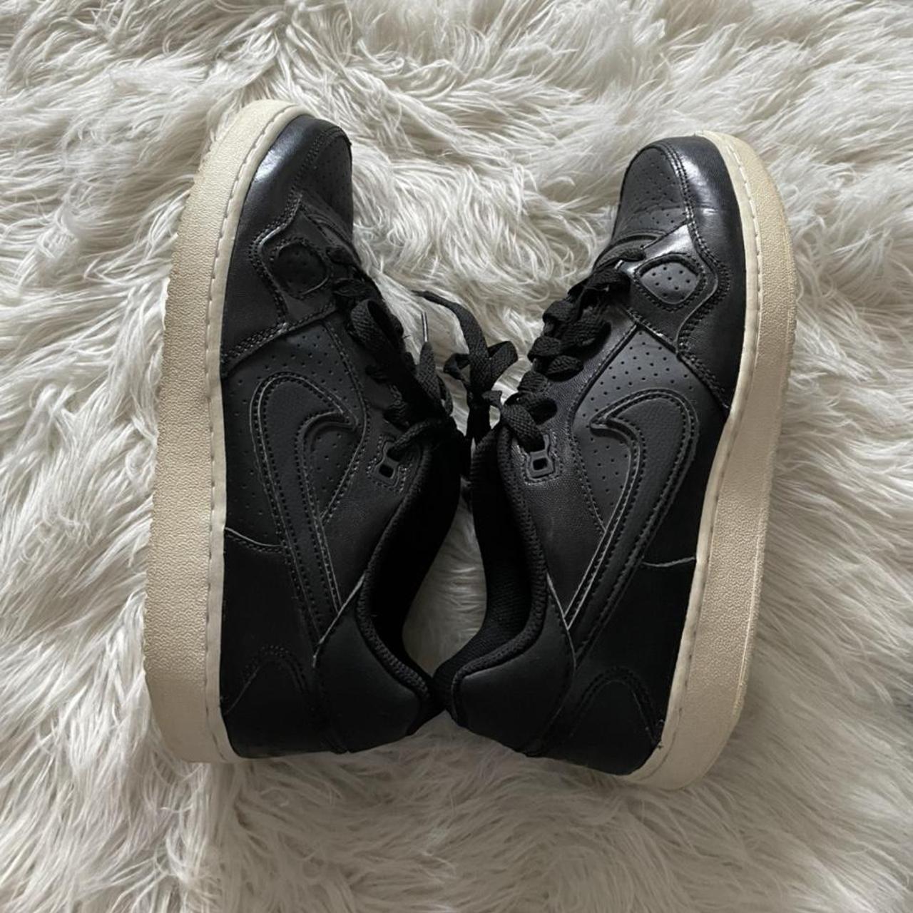 half black and white nike shoes