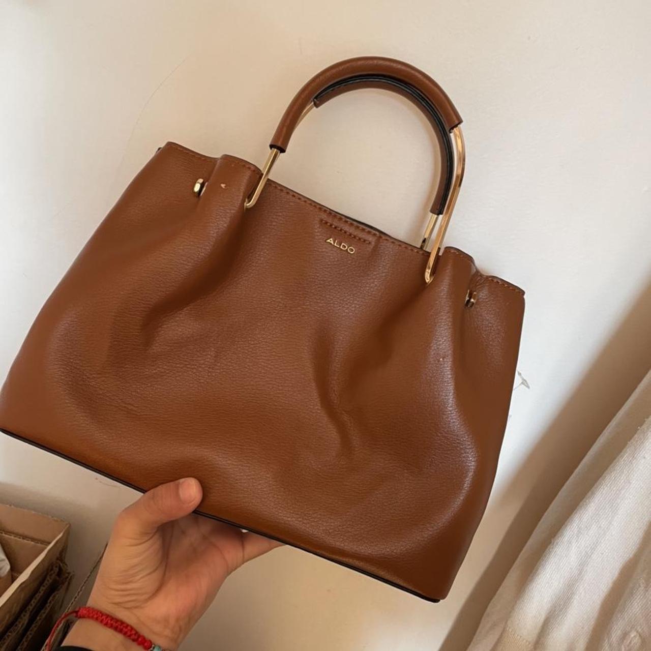 Brown Aldo purse also brings a crossbody strap