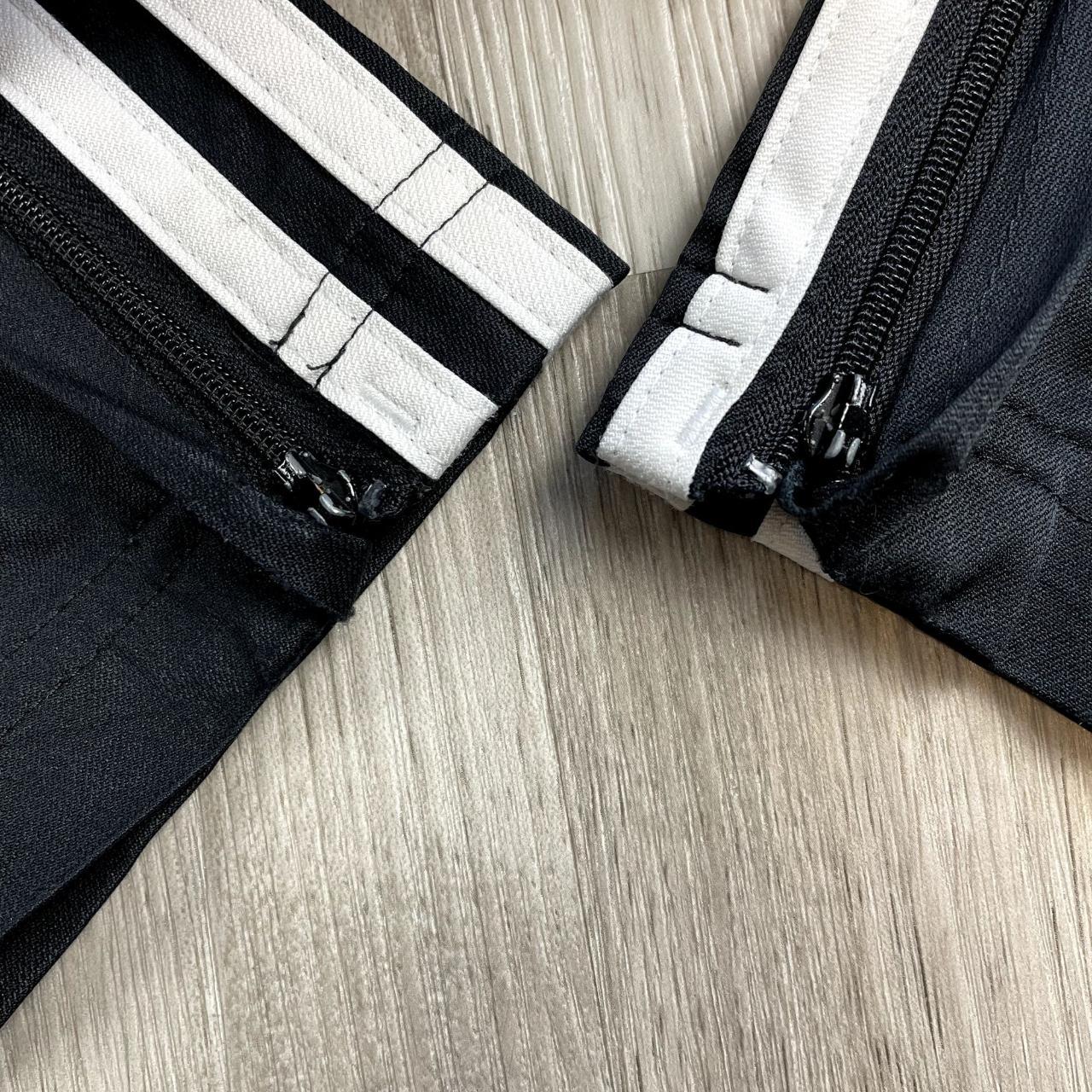 Adidas Climaproof black track pants with embroidered... - Depop