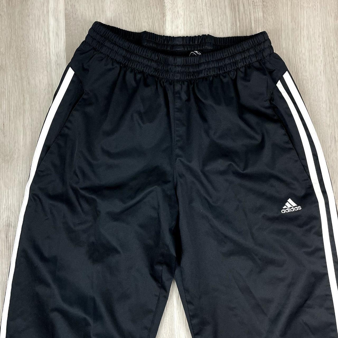 Adidas Climaproof black track pants with embroidered... - Depop