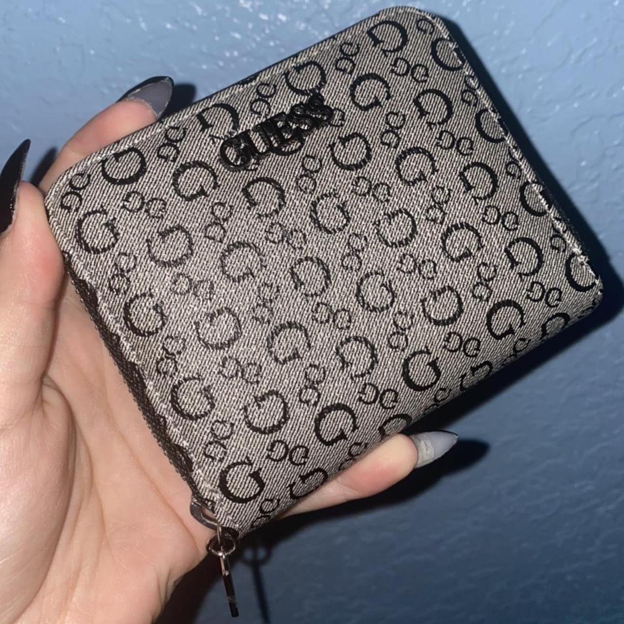 Guess wallet has pockets for cash cards and it s Depop