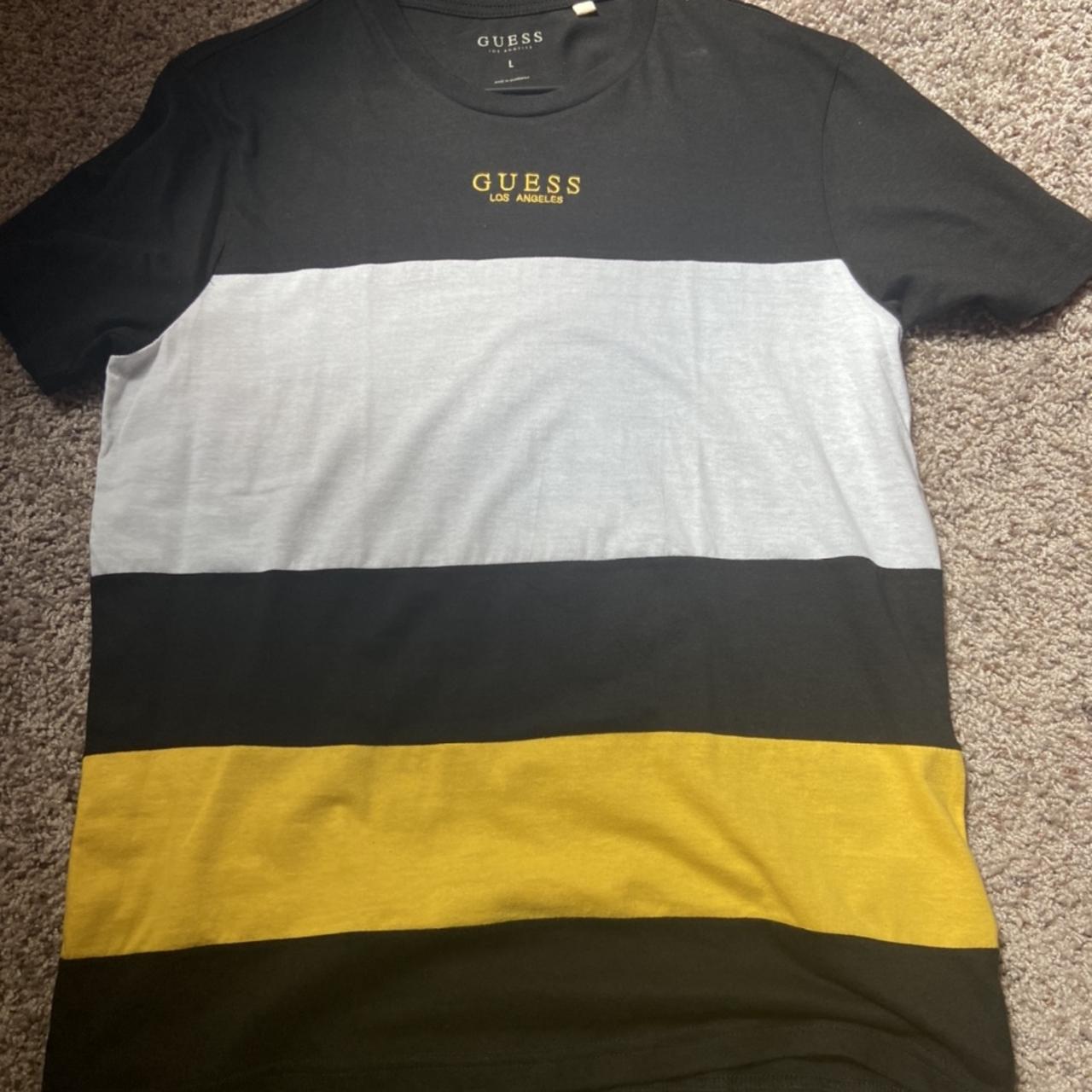 black and yellow guess shirt