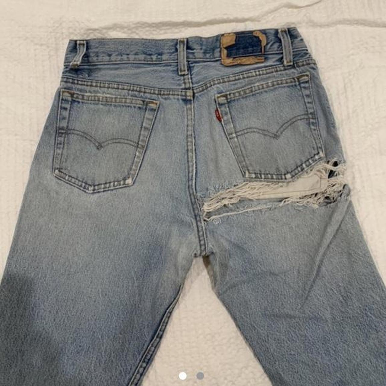 levis with rip under bum