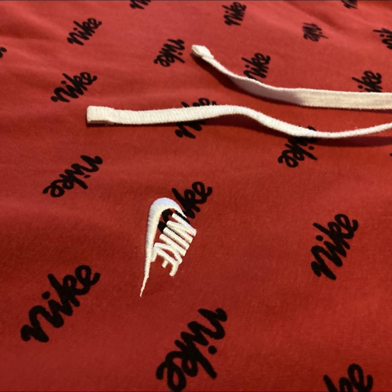 Red Nike hoodie, black Nike print, embroidered white... - Depop