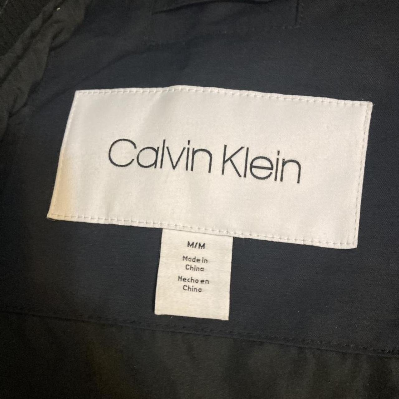 Black Calvin Klein bomber jacket with unique arm... - Depop